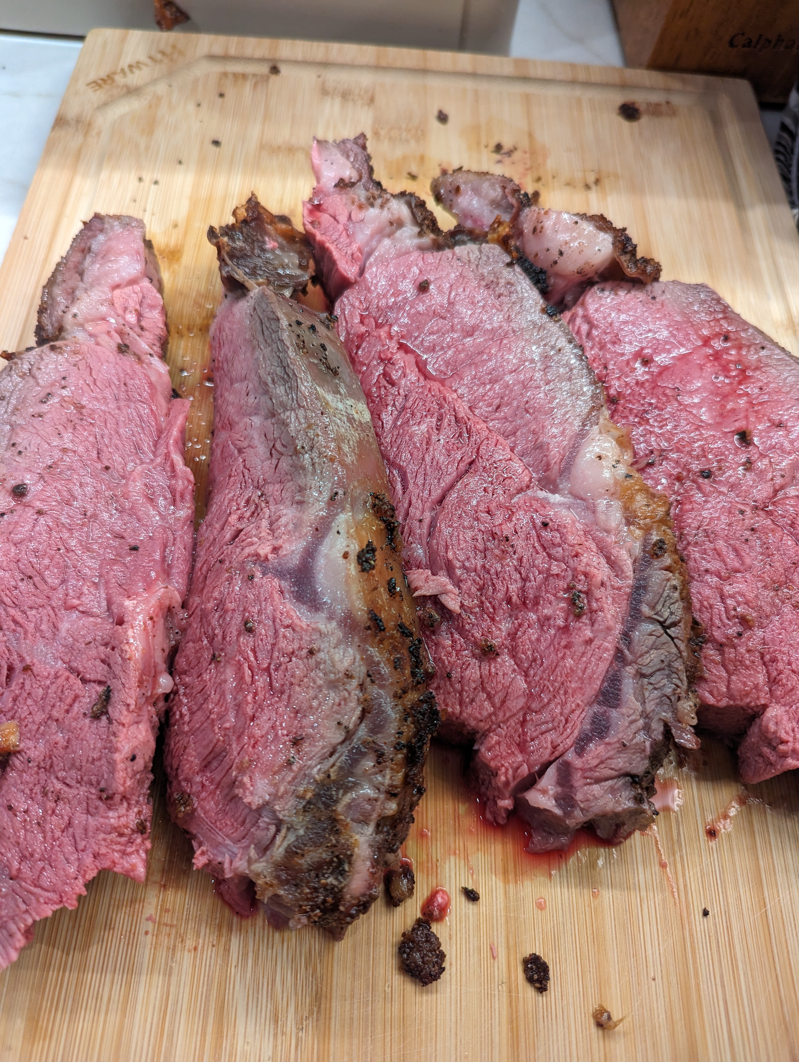 Sliced prime rib on cutting board